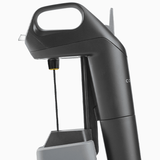 Coravin wine preservation tool featuring a sleek black design and a needle for pouring without removing the cork.