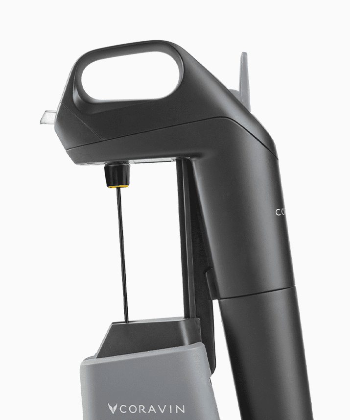 Coravin wine preservation tool featuring a sleek black design and a needle for pouring without removing the cork.